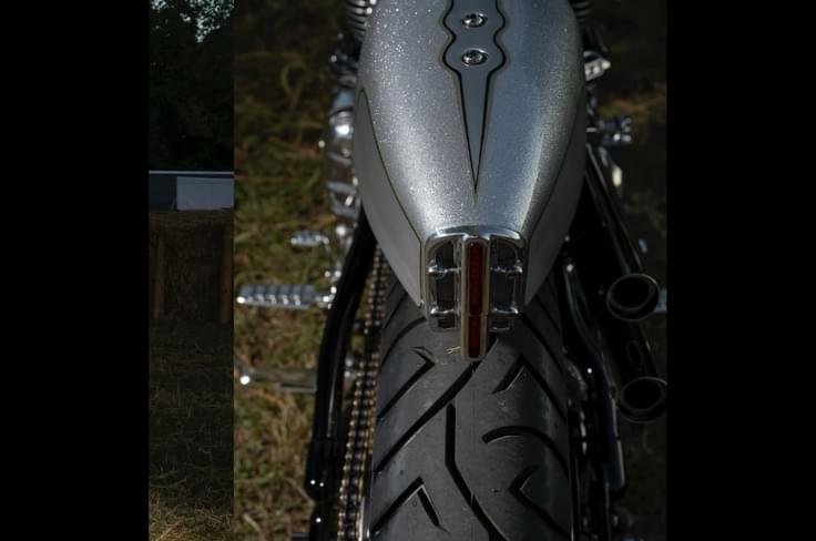 A solo seat with a boxy tail, wire-spoke rims, new swingarm complete the look Royal Enfield Sawn off Shotgun 650 tail section
